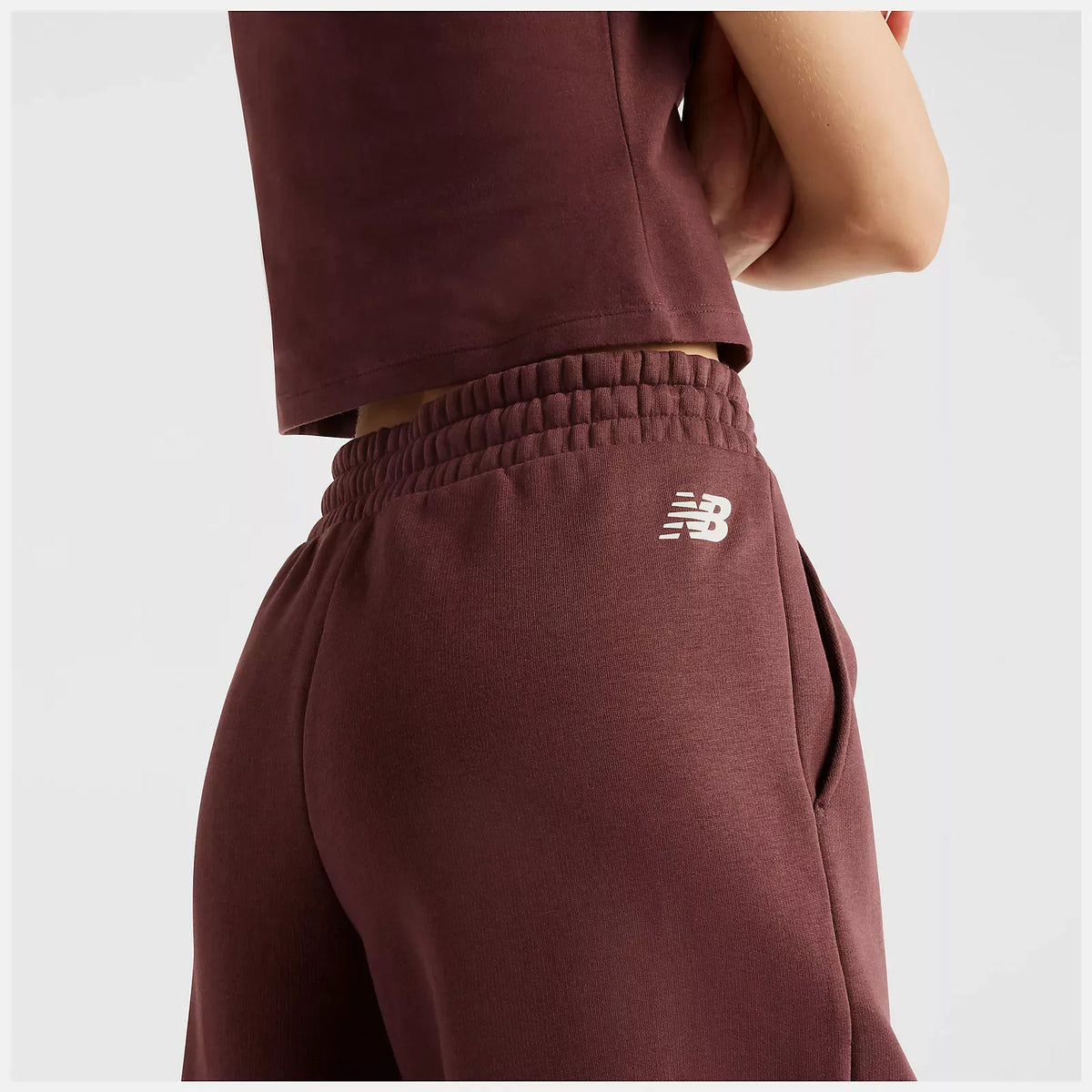 PANTALONI DONNA NEW BALANCE TRACKSIDE FLEECE JOGGERS – BORDEAUX