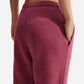 PANTALONI TUTA DONNA NIKE STUDIO LOGO FLEECE – ROSA SMOKE