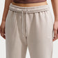 PANTALONI TUTA DONNA NIKE STUDIO LOGO FLEECE – BEIGE