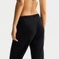PANTALONI DONNA NIKE STUDIO FLEECE BORDO APERTO – NERO