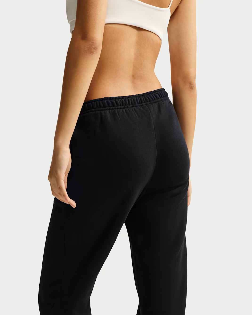 PANTALONI DONNA NIKE STUDIO FLEECE BORDO APERTO – NERO