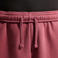 PANTALONI RAGAZZA NIKE STUDIO FLEECE AMPI – ROSA SMOKE